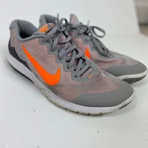 Gray and neon orange Nike’s